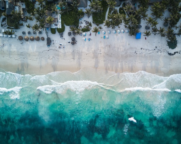 How to be happier and healthier - go to the beach birds eye view